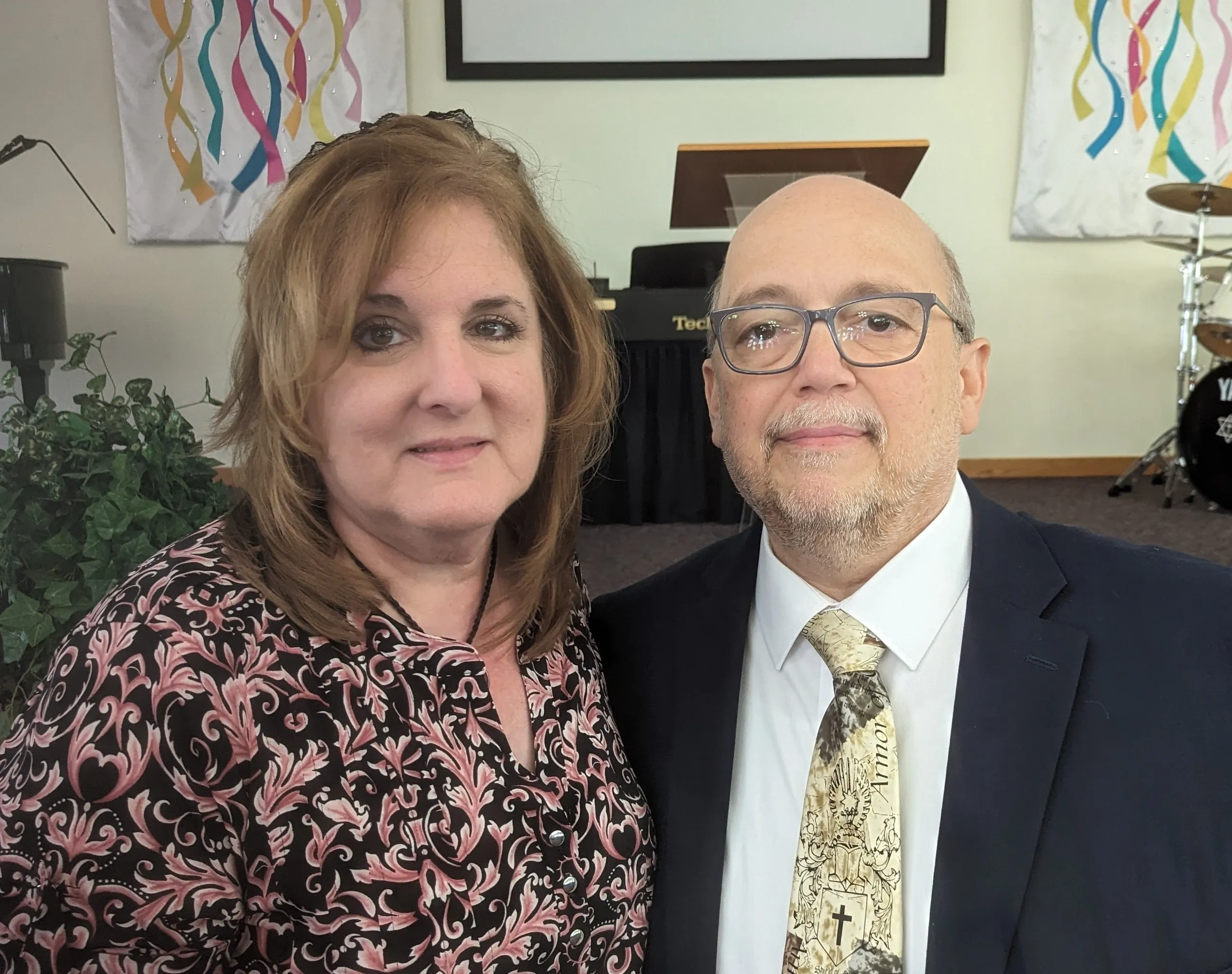 A man and woman standing next to each other.