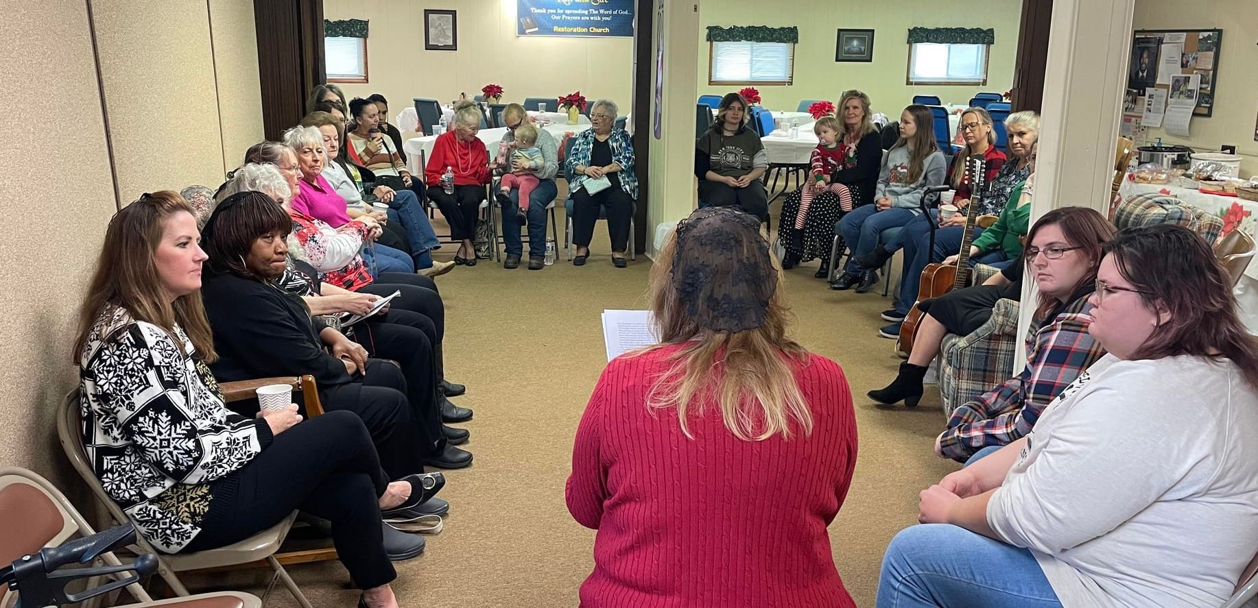 A group of people sitting in a circle.